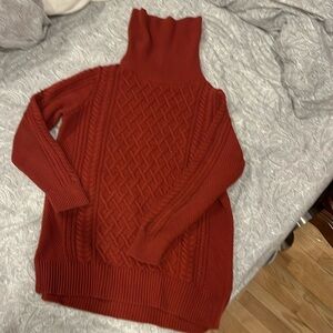 Banana Republic Brick color cable knit weather.  80% cotton 20% nylon.
